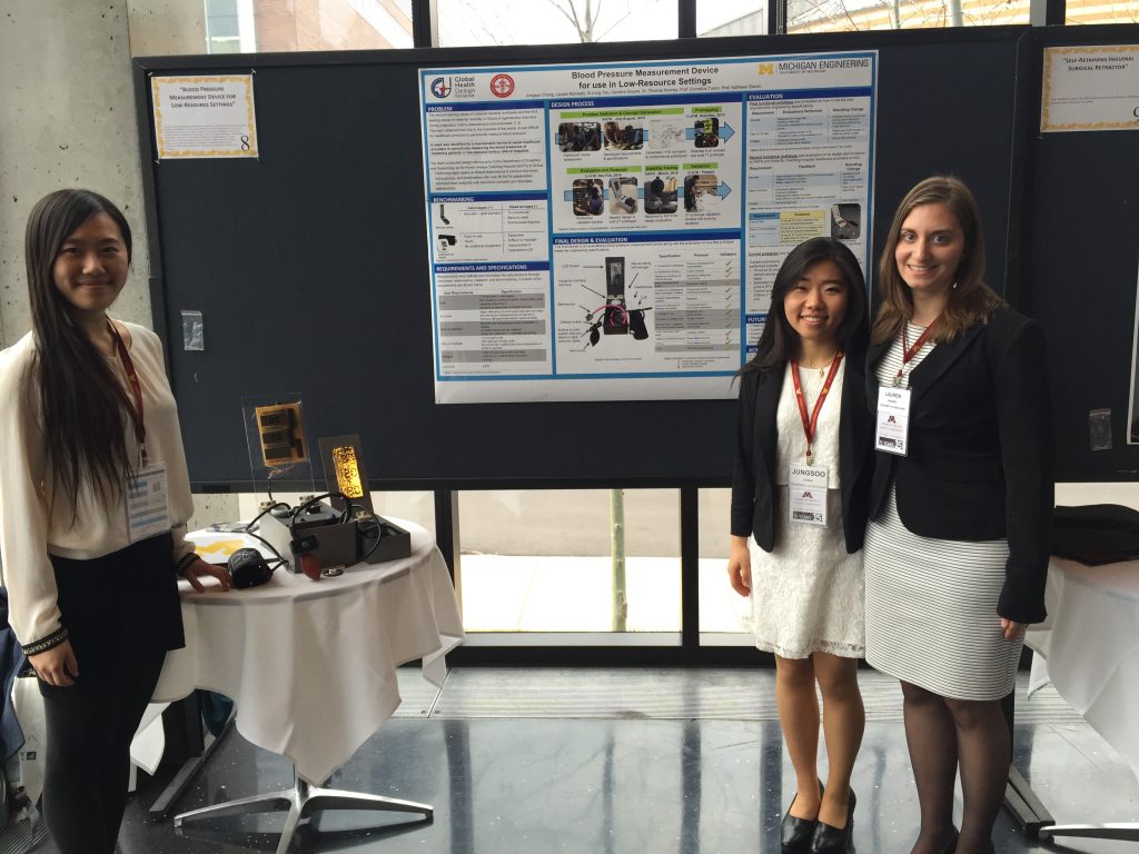 Students presenting research and device at Design for Medical Devices conference at University of Minnesota.